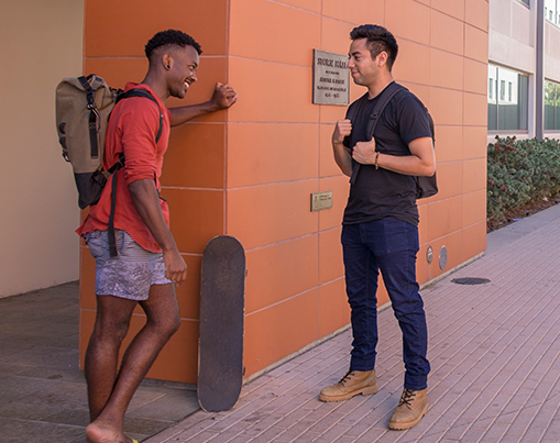 Veteran students talking outside Storm Hall