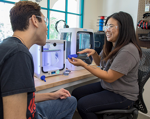 Students working with 3D printers